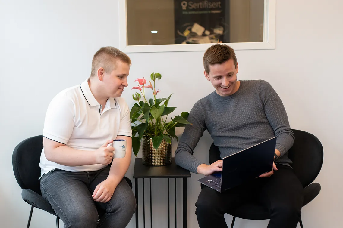 Two men sitting in office - Regnskap Tromsø - Arctic Norway